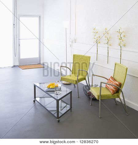Modern room with arm chairs and coffee table.