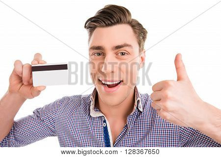 Happy Cheerful Man Holding Bank Card And Showing Thumb Up