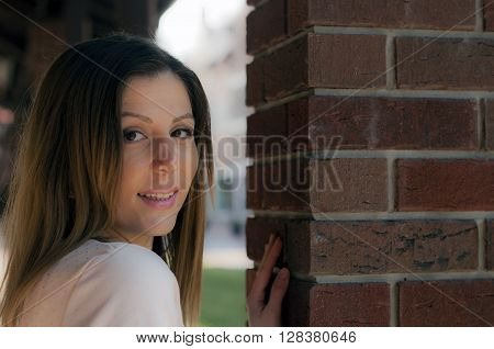 Beautiful and lovely girl looking at the camera with a smile
