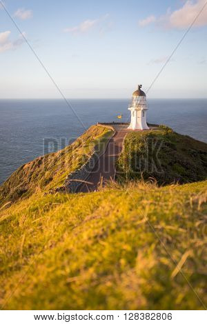 Cape Reinga on the North Island of New Zealand. Pacific Ocean hitting the Tasman Sea.