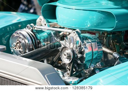 turquoise and chrome engine bay on a high performance vehicle