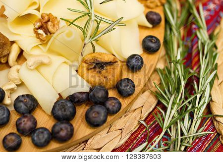 Still life photo with Georgian cheese apple grape fig