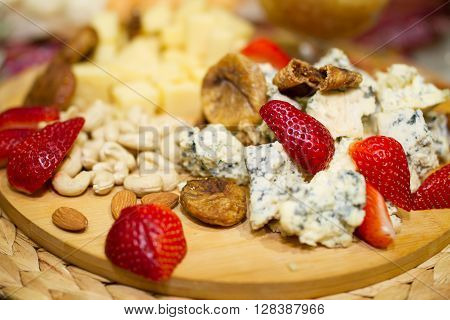 Still life photo with Georgian cheese strawberry grape etc