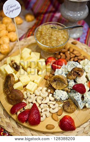 Still life photo with Georgian cheese fig grape almonds
