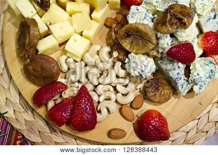Still life photo with Georgian cheese fig grape almonds