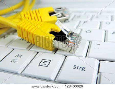 High speed internet connection. Computer cable on a computer keypad.