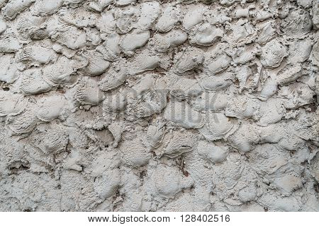 rough cement the wall with scabrous strokes