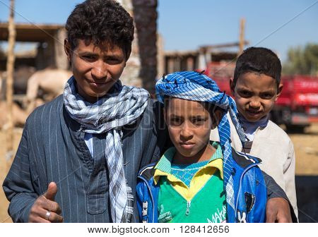 DARAW, EGYPT - FEBRUARY 6, 2016: Portrait of group of local boys at Camel market.