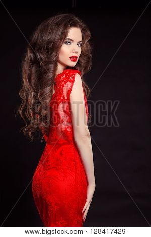 Beautiful Sexy Woman In Red Fashion Dress Isolated On Black Background. Makeup. Beauty Brunette Girl