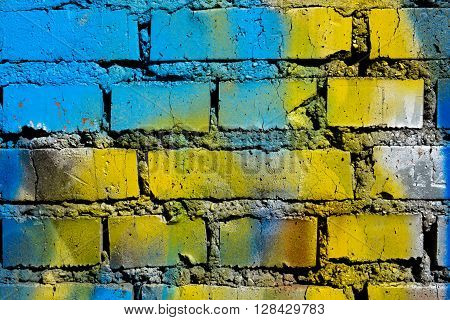 Brick wall painted in different colors abstraction