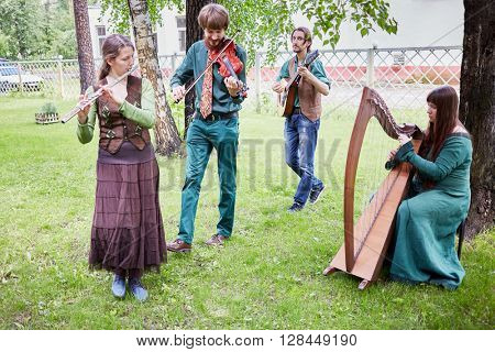 MOSCOW, RUSSIA - MAY 30, 2015: Musical Band Polca an Ri plays music outdoor in park on summer day. Polca an Ri plays traditional irish music.