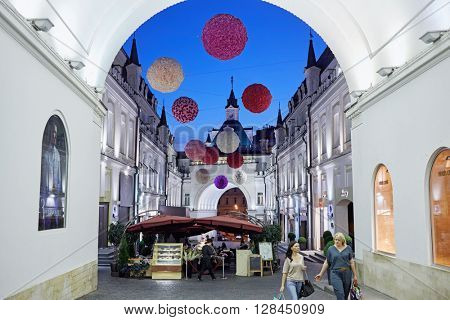 MOSCOW, RUSSIA - JUN 22, 2015: Outdoor cafe and boutiques in Tretyakovsky proezd. Street was built in the 1870-s by brothers-sponsors Tretyakov.