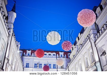 MOSCOW, RUSSIA - JUN 22, 2015: Hanging balls in Tretyakovsky proezd in the evening. Street was built in the 1870-s by brothers-sponsors Tretyakov.