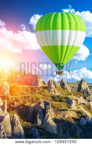 Balloon silhouette in the sunrise sky. Cappadocia, Turkey
