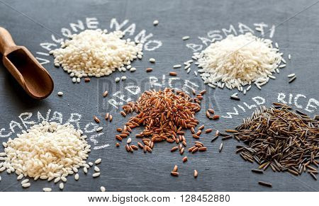 Different Kinds Of Rice On The Dark Background