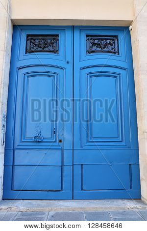 Old door in the city of Paris