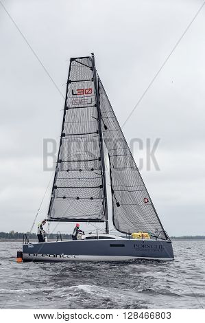 KYIV, UKRAINE - APRIL 26, 2016: Traning on the new model of yacht OceanTECH L30 on the Kyiv water reservoir or Kyiv SEA with Rodion Luka, L30 idea author, Silver Olympic medalist.