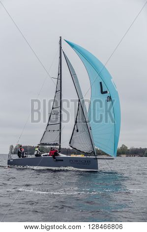 KYIV, UKRAINE - APRIL 26, 2016: Traning on the new model of yacht OceanTECH L30 on the Kyiv water reservoir or Kyiv SEA with Rodion Luka, L30 idea author, Silver Olympic medalist.