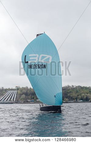 KYIV, UKRAINE - APRIL 26, 2016: Traning on the new model of yacht OceanTECH L30 on the Kyiv water reservoir or Kyiv SEA with Rodion Luka, L30 idea author, Silver Olympic medalist.