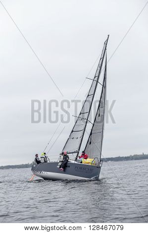KYIV, UKRAINE - APRIL 26, 2016: Traning on the new model of yacht OceanTECH L30 on the Kyiv water reservoir or Kyiv SEA with Rodion Luka, L30 idea author, Silver Olympic medalist.
