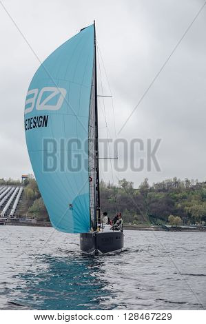 KYIV, UKRAINE - APRIL 26, 2016: Traning on the new model of yacht OceanTECH L30 on the Kyiv water reservoir or Kyiv SEA with Rodion Luka, L30 idea author, Silver Olympic medalist.