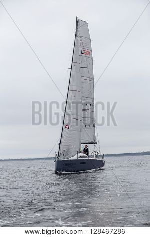 KYIV, UKRAINE - APRIL 26, 2016: Traning on the new model of yacht OceanTECH L30 on the Kyiv water reservoir or Kyiv SEA with Rodion Luka, L30 idea author, Silver Olympic medalist.
