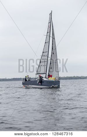 KYIV, UKRAINE - APRIL 26, 2016: Traning on the new model of yacht OceanTECH L30 on the Kyiv water reservoir or Kyiv SEA with Rodion Luka, L30 idea author, Silver Olympic medalist.
