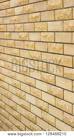 a wall of a wild yellow decorative stone