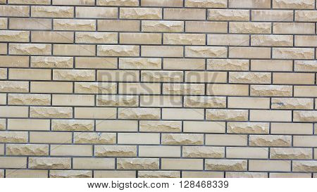 a wall of a wild yellow decorative stone