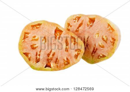 Sliced near ripe ox heart tomato Solanum lycopersicum showing many small seed compartments called locules and a nice pink flesh.