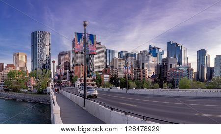 CALGARY, CANADA - MAY 1: Panorama of Calgary's skyline from the centre street bridge on May 1, 2016 in Calgary, Alberta. The famous Bow River is in the foreground.