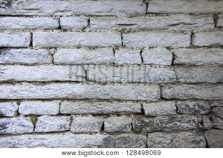 Grunge gray bricks texture wall and background with beige and white color combination