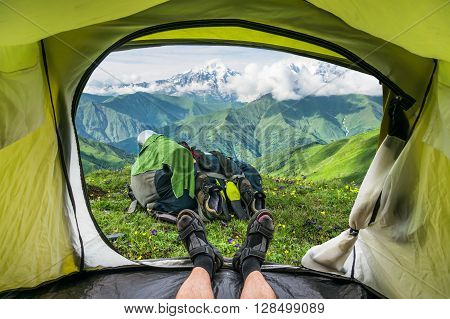 View from inside a tent on the snow-capped mountains in Georgia (Svaneti)