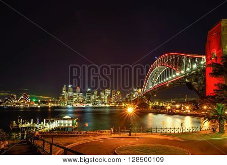 Long exposure fo SYDNEY AUSTRALIA - August, 8, 2016: View of Sydney Opera House and Harbour Bridged with red light celebrate chainese new year in Sydney Australia Over 10 millions tourists visit Sydney every year