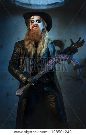Man holds in his hand a sickle he is an evil and terrible.