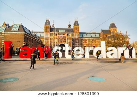 Amsterdam, Netherlands - March 31, 2016: People making photo in front of the sign, I amsterdam,  at Museumplein, Rijksmuseum