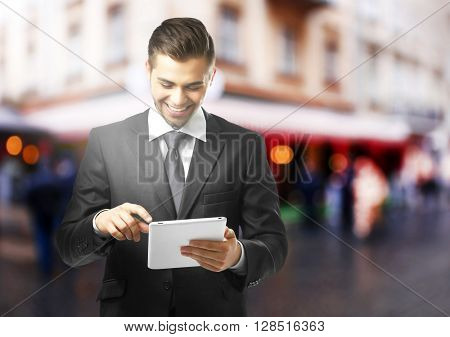 Young urban man using tablet-pc
