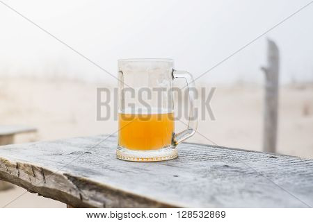 Mug With Wheat Beer On The Bench