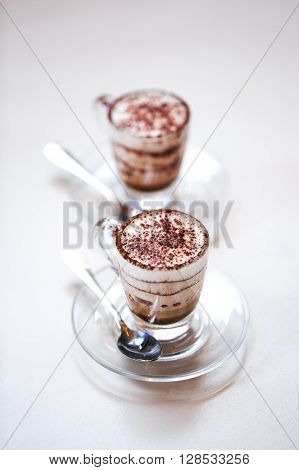 Italian traditional coffee macciato, made in Milan. This beverage contains dark chocolate, hot frothed milk and espresso.