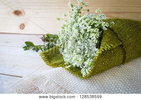 white flowers on a wooden background, a spring bouquet.