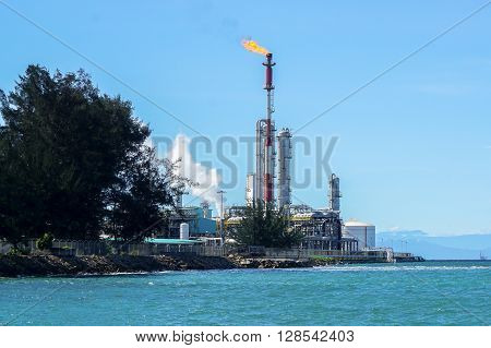 Labuan,Malaysia-May 4,2016:Petronas Methanol Labuan with fire torching against the sky burning gas flaring Gas or flare burn at Rancha-Rancha industrial,Labuan,Malaysia on 4th May 2016.
