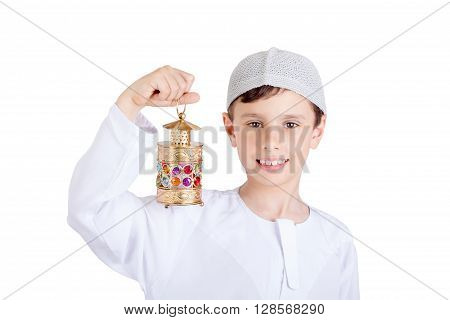 Happy Ramadan - Young boy smiling and holding Ramadan lantern