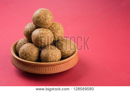 The indian sesame sweet or tilgul laddu, made up of jaggery and sesame seeds, hand made, round, indian sweet prepared in Makar Sankranti festival