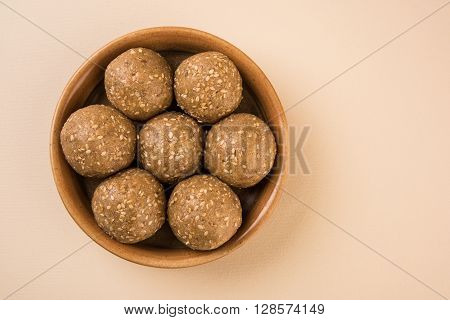 The indian sesame sweet or tilgul laddu, made up of jaggery and sesame seeds, hand made, round, indian sweet prepared in Makar Sankranti festival