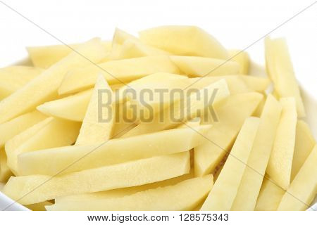 closeup of a bowl full of sliced potatoes ready to fry