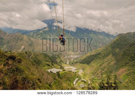 Silhouette Of Young Man On A Swing called Flight of the Condor Banos de Agua Santa Ecuador