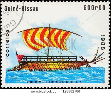 MOSCOW RUSSIA - MAY 01 2016: A stamp printed in Guinea-Bissau shows image of ancient war ship - Bireme Etrusca series 
