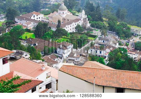 Charming village of Guapolo in Quito Ecuador with houses built downward valley, spectacular view Andes mountains.