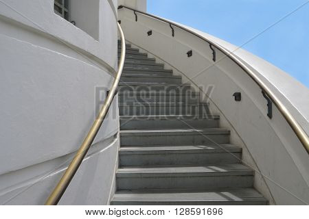 LOS ANGELES - MAY 3: Beautiful outdoor white spiral staircase with bronze railings that leads up to the top of the Griffith Observatory telescope.