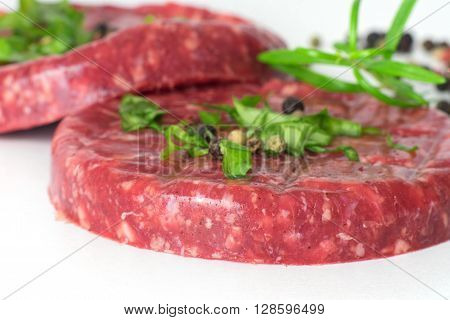 Raw beef hambuger isolated on white background